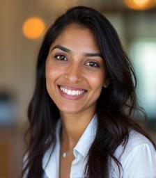 Priya Patel, Client Care Coordinator, smiling at clinic reception
